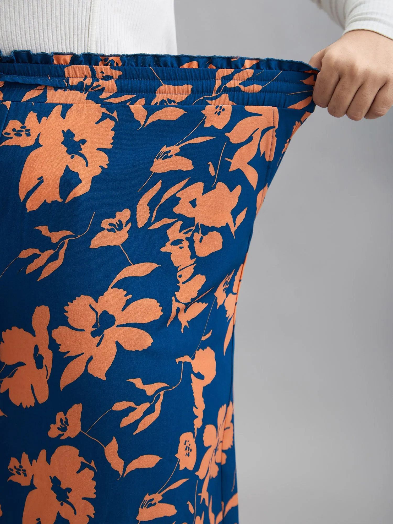 Floral Smocked Waist Flared Leg Pants
